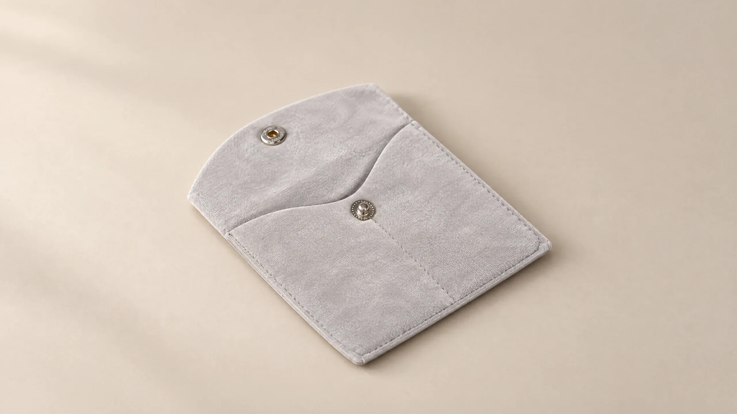 Jewellery pouch with compartments in Grey, lying flat, closed