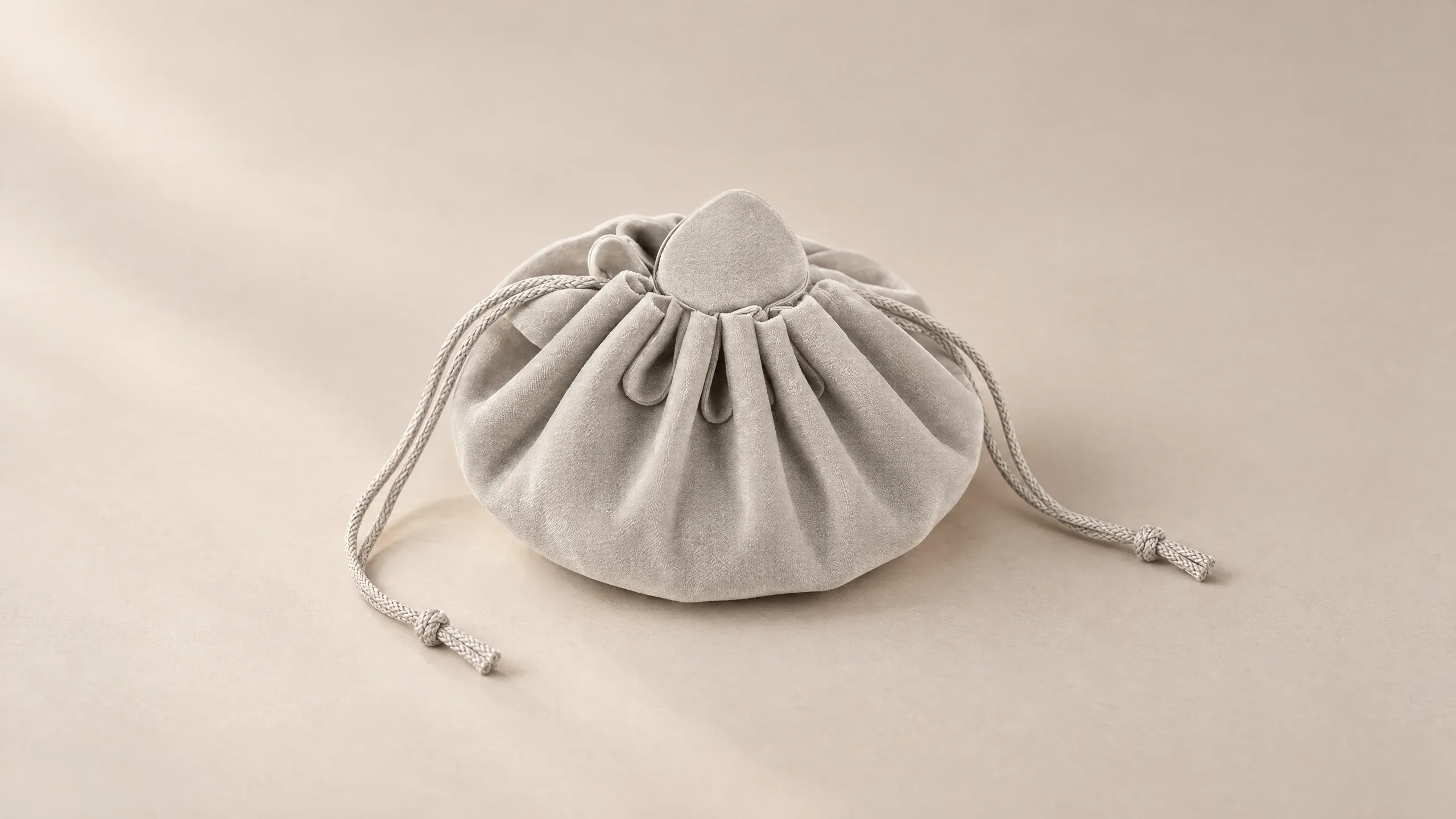 Drawstring jewellery pouch in Grey, pulled shut