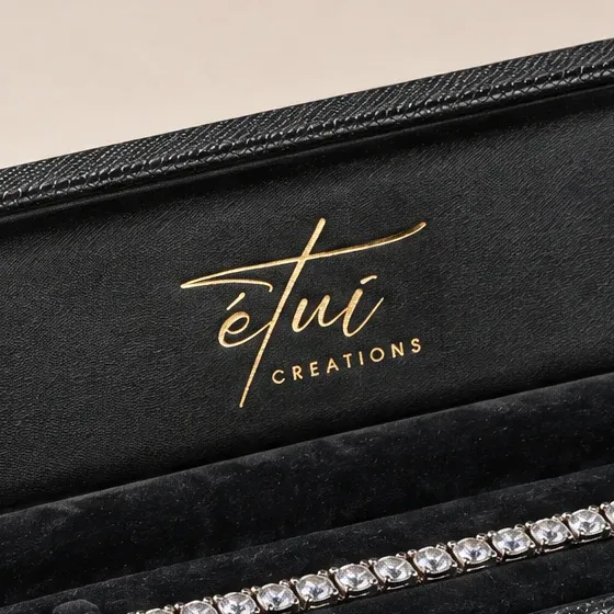 Gold-stamped logo inside the lid